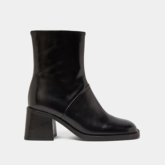 Square-toe boots with exposed seams in black leather